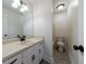 Bright bathroom with tile floors, white vanity, and a walk-in shower at 857 Winding Trl, Lawrenceville, GA 30046