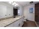 Bright bathroom featuring a granite countertop vanity, decorative tile flooring and walk-in shower at 857 Winding Trl, Lawrenceville, GA 30046