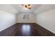 Spacious bedroom with hardwood floors and a ceiling fan at 857 Winding Trl, Lawrenceville, GA 30046