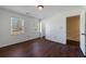 Bedroom with hardwood floors, natural light from two windows, and neutral paint at 857 Winding Trl, Lawrenceville, GA 30046