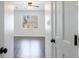 Bright bedroom features hardwood floors and a window offering natural light at 857 Winding Trl, Lawrenceville, GA 30046