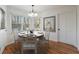 Charming breakfast nook with bright windows, hardwood floors, and a stylish chandelier at 857 Winding Trl, Lawrenceville, GA 30046