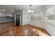 Eat-in kitchen featuring stainless appliances, granite countertops, and natural light from windows at 857 Winding Trl, Lawrenceville, GA 30046