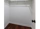 Walk in closet offers built in shelving and wood flooring at 857 Winding Trl, Lawrenceville, GA 30046