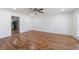 Bright room with hardwood floors leading to an open kitchen and backyard at 857 Winding Trl, Lawrenceville, GA 30046