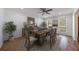 Elegant dining room with a rustic table, decor, and natural light at 857 Winding Trl, Lawrenceville, GA 30046