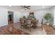 Bright dining room featuring hardwood floors, chair rail, and a stylish ceiling fan at 857 Winding Trl, Lawrenceville, GA 30046
