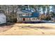 Charming two-story home with a well-maintained lawn and mature trees at 857 Winding Trl, Lawrenceville, GA 30046