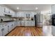 Charming kitchen with stainless steel appliances, granite counters, and hardwood floors at 857 Winding Trl, Lawrenceville, GA 30046