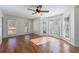 Inviting room with many windows that provide natural light and hardwood floors at 857 Winding Trl, Lawrenceville, GA 30046