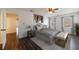 Cozy main bedroom featuring wood floors, neutral decor, natural light, and ceiling fan at 857 Winding Trl, Lawrenceville, GA 30046