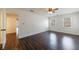Main bedroom features wood floors, neutral decor, natural light, and ceiling fan at 857 Winding Trl, Lawrenceville, GA 30046