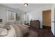 Inviting main bedroom featuring hardwood floors, natural light, and closet access at 857 Winding Trl, Lawrenceville, GA 30046
