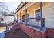 Inviting front porch with brick foundation and decorative railing at 857 Winding Trl, Lawrenceville, GA 30046
