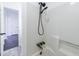 Shower with a rainfall showerhead and grab bar at 857 Winding Trl, Lawrenceville, GA 30046