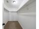 Spacious walk-in closet with shelves and carpeted floor at 857 Winding Trl, Lawrenceville, GA 30046
