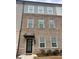 Charming brick-front townhome with a covered entrance and well-lit facade at 161 Jameson Dr, Acworth, GA 30102