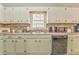 Kitchen featuring stone backsplash, lots of counterspace, and stainless steel appliances at 283 Reynolds Bridge Rd, Kingston, GA 30145