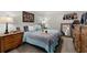 Comfortable bedroom features a wooden dresser, stylish mirror, and ample natural light at 5211 Centennial Hill Nw Dr, Acworth, GA 30102
