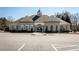 Exterior view of the community clubhouse with ample parking and manicured landscaping at 5211 Centennial Hill Nw Dr, Acworth, GA 30102