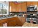 Modern kitchen with stainless steel appliances, granite countertops, and ample cabinet space at 5211 Centennial Hill Nw Dr, Acworth, GA 30102