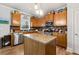 Well-appointed kitchen featuring granite countertops, stainless steel appliances, and ample cabinet space at 5211 Centennial Hill Nw Dr, Acworth, GA 30102