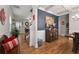 Bright and airy living room boasting hardwood floors, white trim, and a decorative accent wall at 5211 Centennial Hill Nw Dr, Acworth, GA 30102