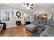 Bright living room featuring fireplace, hardwood floors, and neutral paint at 5211 Centennial Hill Nw Dr, Acworth, GA 30102