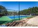 Well-maintained community tennis court with green and blue surface and surrounding greenery at 5211 Centennial Hill Nw Dr, Acworth, GA 30102