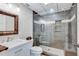 Modern bathroom featuring a glass-enclosed shower, stylish vanity, and tile accents at 7875 Robin Rd, Cumming, GA 30041