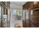 Spacious custom closet with built-in storage and a cozy cushioned stool at 7875 Robin Rd, Cumming, GA 30041