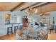 Open floor plan with dining area, living room, and hardwood floors at 7875 Robin Rd, Cumming, GA 30041