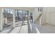 Spacious living room with large sliding glass doors leading to an outdoor deck at 7875 Robin Rd, Cumming, GA 30041