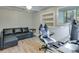 Home office features a modern desk setup and comfortable seating area at 7875 Robin Rd, Cumming, GA 30041
