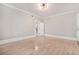 Bright living room boasts hardwood floors, neutral paint, and modern light fixture at 1156 Piedmont Ne Ave # B3, Atlanta, GA 30309