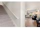 View of stairs leading to the upstairs, and the living room's modern design and hardwood floors at 216 Epping St # 5, Stockbridge, GA 30281