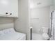 Modern bathroom with white cabinets, a toilet and shower/tub with a curtain at 2340 Beaver Ruin Rd # Un62, Norcross, GA 30071
