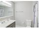 Bathroom featuring a gray vanity, large mirror and a toilet at 2340 Beaver Ruin Rd # Un62, Norcross, GA 30071