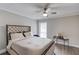 Bedroom with tufted headboard, neutral paint and a ceiling fan at 2340 Beaver Ruin Rd # Un62, Norcross, GA 30071