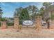 A stone pillar entrance with a sign welcomes you to the Robinwood Condominiums community at 2340 Beaver Ruin Rd # Un62, Norcross, GA 30071