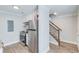 Bright kitchenette features white cabinets, stainless steel appliances, and granite countertops at 2340 Beaver Ruin Rd # Un62, Norcross, GA 30071