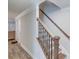 Staircase featuring wood and wrought iron design, neutral paint and white trim at 2340 Beaver Ruin Rd # Un62, Norcross, GA 30071
