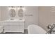 A bathroom features a double sink vanity, soaking tub, and modern fixtures at 2769 Glenwood Se Ave, Atlanta, GA 30317