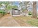 Charming home featuring a quaint covered porch, gray siding and freshly painted white brick at 2769 Glenwood Se Ave, Atlanta, GA 30317
