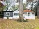 Charming home with a white brick facade and a covered front porch at 2769 Glenwood Se Ave, Atlanta, GA 30317