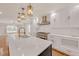 An open-concept kitchen features a large center island, modern pendant lights, and stainless steel appliances at 2769 Glenwood Se Ave, Atlanta, GA 30317