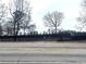 Street view of a long fence on the property line of a golf course in the community at 2769 Glenwood Se Ave, Atlanta, GA 30317