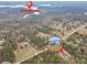 Aerial view of a property near Tussahaw Reservoir; house is highlighted in a zoomed view at 3911 Peeksville Rd, Locust Grove, GA 30248