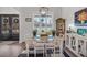 Modern dining area with sleek furniture, open lighting, and bright natural light at 3911 Peeksville Rd, Locust Grove, GA 30248