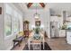 Bright dining area with wood beams, modern lighting, and large window at 3911 Peeksville Rd, Locust Grove, GA 30248